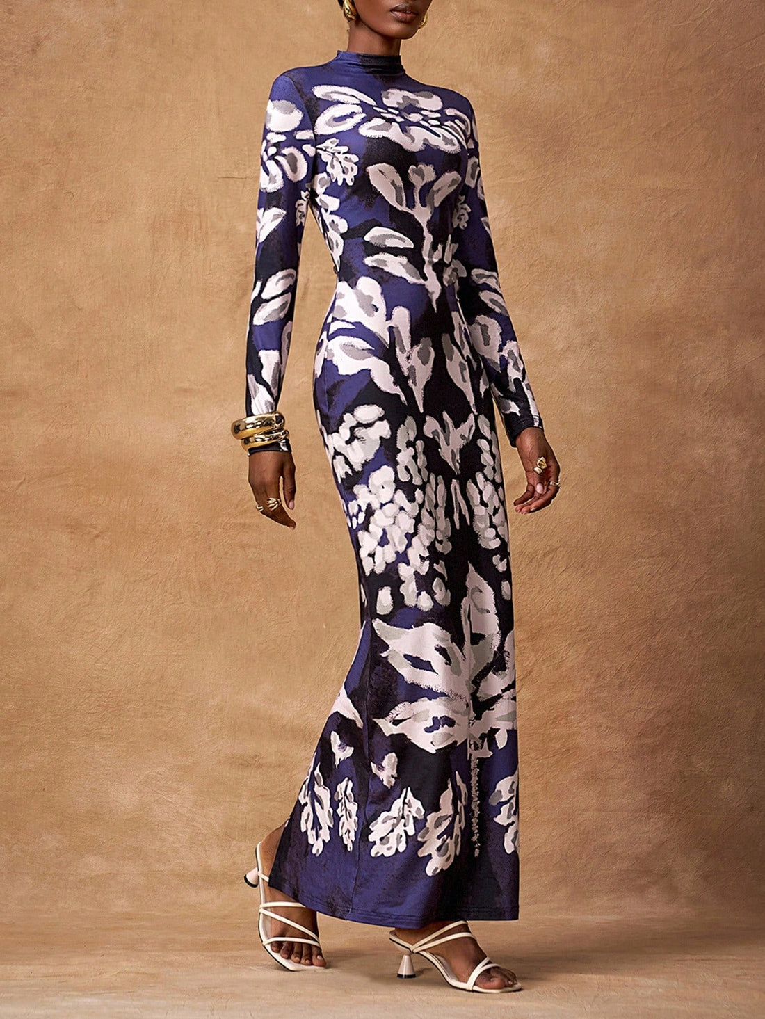 Step back in time with this stunning retro maxi dress that effortlessly blends vintage charm with modern sophistication. Designed for the fashion-forward woman, this dress features a flattering silhouette that works beautifully through fall and winter months. Whether you're heading to a special occasion or elevating your everyday style, this piece delivers timeless elegance with a playful twist. The flowing maxi length and classic retro details make it a versatile wardrobe essential that'll have you feeling