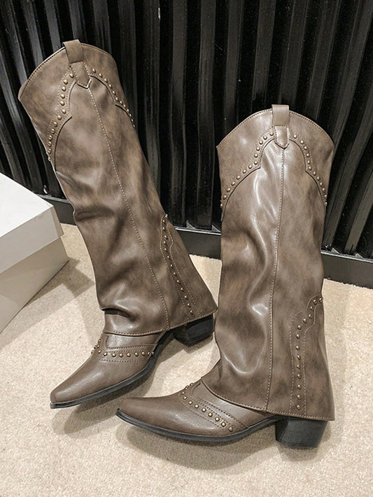 Upgrade your wardrobe with these Chic Retro Rivet High Tube Cowboy Boots for Women. Made with French style and versatile enough to fit any occasion, these boots will bring a touch of Western charm to any outfit. The vintage-inspired rivet detailing adds a unique twist to these classic boots.