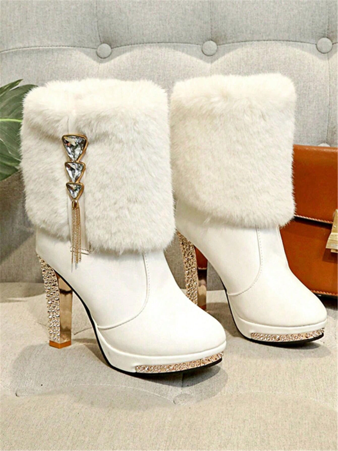 Stun this season with our Chic Rhinestone-Trimmed Mid-Calf Boots with Fur Accents! Perfect for autumn and winter, these boots are not only stylish but also functional, keeping your feet warm and comfortable. With a rhinestone-trimmed design, these boots will add a touch of glamour to any outfit.