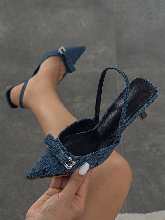 Elevate your style with our Chic Rhinestone Bow Pointed Toe Slingback Pumps. These stylish blue footwear feature pyramid heels, adding a touch of elegance to any outfit. The pointed toe and slingback design provide a comfortable and secure fit, while the rhinestone bow adds a touch of glamour. Perfect for a fashionable flair.