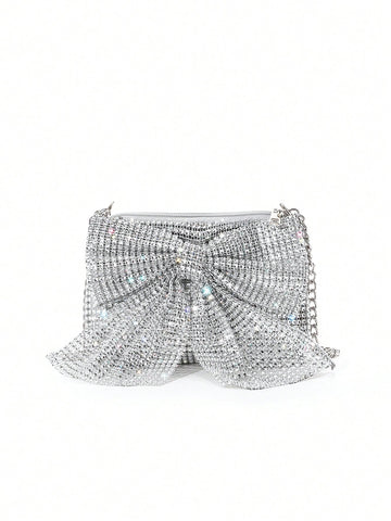 Get ready to turn heads with our Chic Rhinestone Bowknot One-Shoulder Clutch! Perfect for gala, prom, and cocktail events, this stunning clutch features a sparkling rhinestone bowknot and a comfortable one-shoulder strap. Make a statement and add a touch of elegance to any outfit with this must-have accessory.