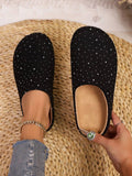 Elevate your everyday comfort with these stunning rhinestone-embellished mule slippers. Featuring a discreet wedge heel that adds height and flatters your silhouette, these versatile slippers transition seamlessly from relaxed loungewear to party-ready style. The sparkling rhinestone detailing catches the light beautifully, making them a chic accessory for any occasion. Slip them on for instant glamour without sacrificing comfort—the perfect blend of sophistication and ease.