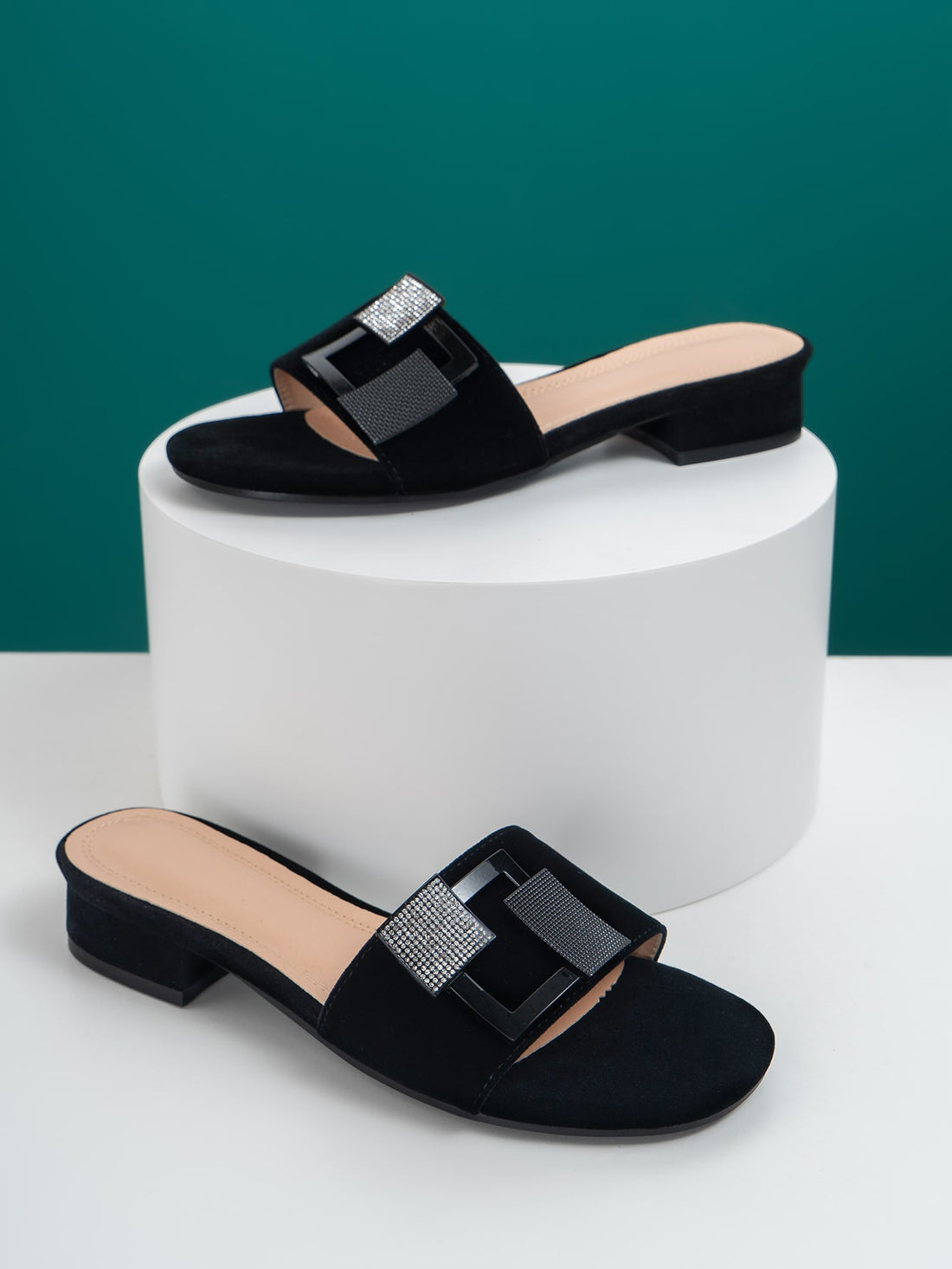 Sparkle through your summer with these dazzling rhinestone slide sandals! Designed for the woman who refuses to compromise on glamour, these trendy flats feature eye-catching embellishments that transform any casual outfit into a statement look. Slip them on for effortless style—whether you're heading to brunch, running errands, or soaking up the sun. Comfortable enough for all-day wear, these chic slides bring that perfect touch of bling to your warm-weather wardrobe. Because who says practical can't be fa