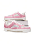 Side profile of pink rhinestone platform sneakers with white laces and crystal midsole strips