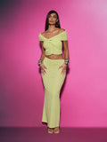 Turn heads at your next event in this stunning two-piece set that effortlessly blends elegance with edge. The twisted off-shoulder crop top features delicate ruched mesh detailing that flatters your silhouette, while the flowing maxi skirt creates a dramatic, sophisticated look. Perfect for weddings, parties, and special occasions, this ensemble strikes the ideal balance between daring and refined. Mix and match the pieces with your favorite accessories to create endless styling possibilities. Slip into con