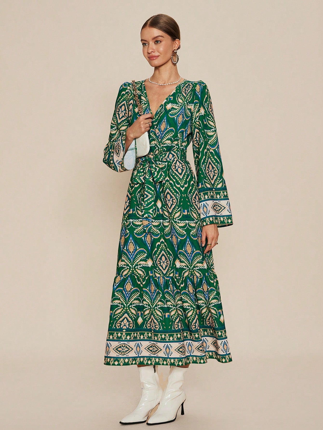 Experience casual elegance with our Chic Ruffle Hem V-Neck Dress. Featuring a trendy allover print and a flowy ruffle hem, this dress is perfect for any occasion. The V-neck adds a touch of sophistication, making it a versatile addition to your wardrobe. Elevate your style effortlessly with this chic dress.