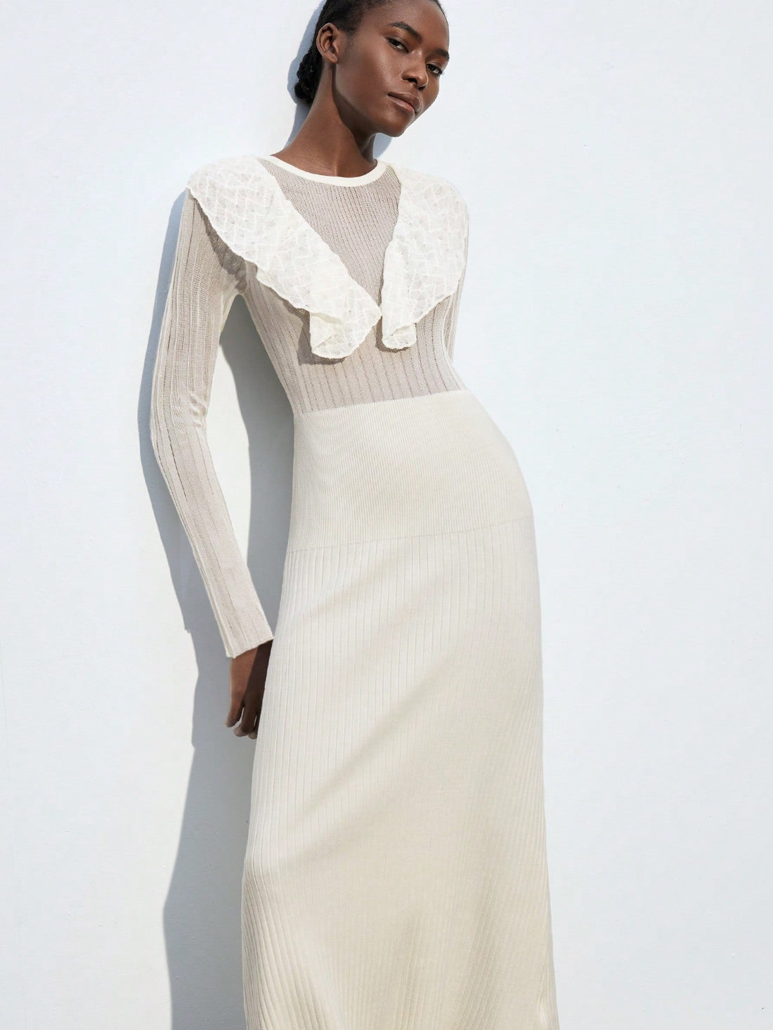 Elevate your everyday style with this charming A-line sweater dress that effortlessly transitions from office to evening. The delicate ruffle trim adds a touch of whimsy and sophistication, while the flattering silhouette celebrates your curves with grace. Crafted for comfort and versatility, this dress pairs beautifully with boots, sneakers, or heels—making it your go-to piece for brunch dates, casual Fridays, or those moments when you want to feel polished without trying too hard. A wardrobe essential tha