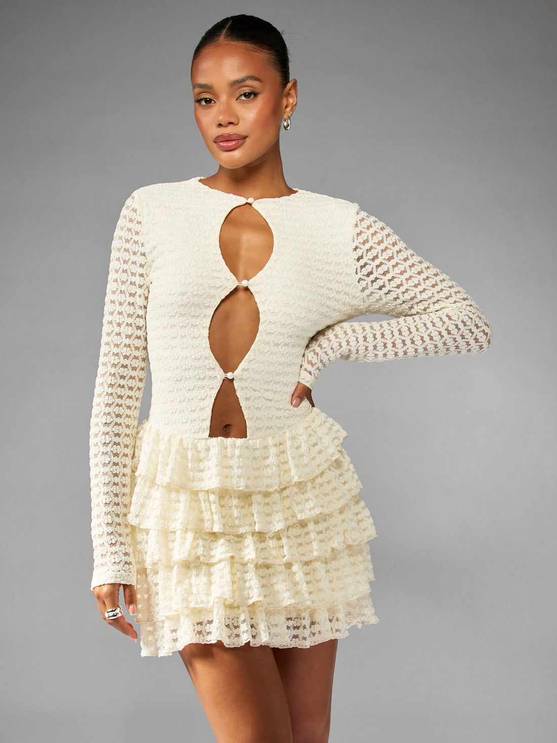 Get ready to turn heads in our Chic Ruffled Tier Mini Dress! With delicate crochet lace and elegant pearl buttons, this dress is the perfect choice for any winter party or wedding. The ruffled tiers add a touch of playfulness to this sophisticated piece. Be the life of the party in this one-of-a-kind dress!