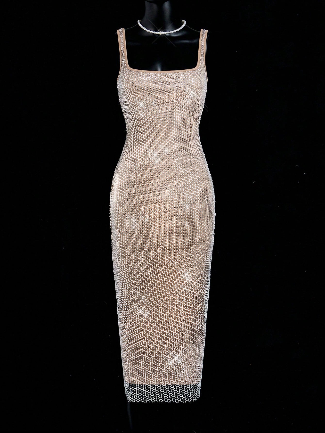 Unleash your inner fashionista with our Chic Sheer Mesh Bodycon Dress. Designed for elegance, this mid-length dress features a sheer mesh fabric that adds a touch of allure. Perfect for any occasion, it will elevate your style and highlight your curves. Turn heads and make a statement with this iconic dress.