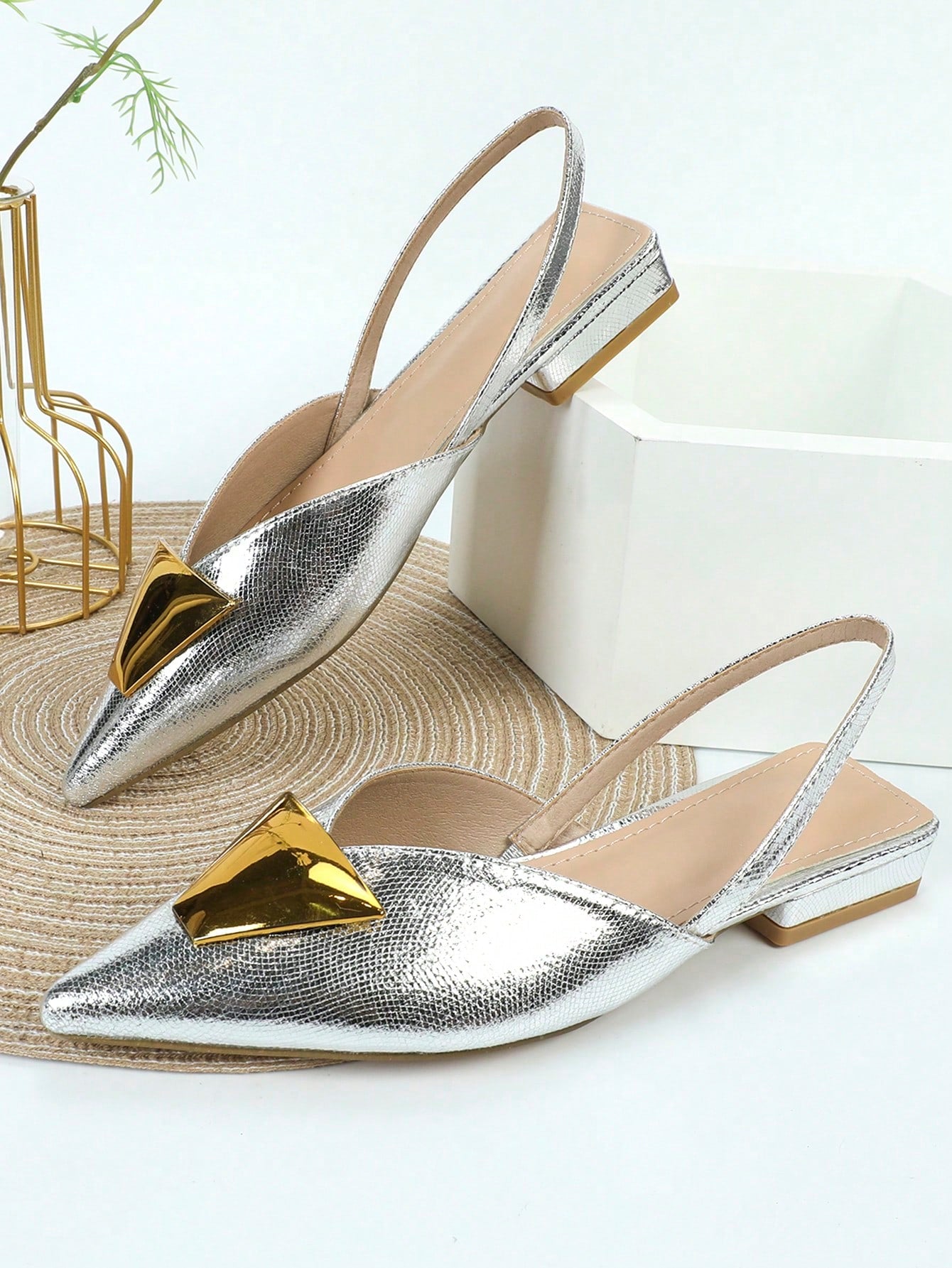 Elevate your style with these chic silver closed-toe flat party shoes. Perfect for any occasion, their versatile elegance adds a touch of sophistication to any outfit. With a comfortable and stylish design, they are the perfect choice for all-day wear.