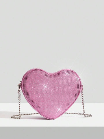 Add a touch of sparkle to your Valentine's Day outfit with this chic silver heart crossbody bag. Its sleek design and shimmering finish make it the perfect playful accessory to carry your essentials while turning heads. Lightweight and easy to wear, this bag effortlessly complements any look, adding a fun and flirty vibe to your special day.