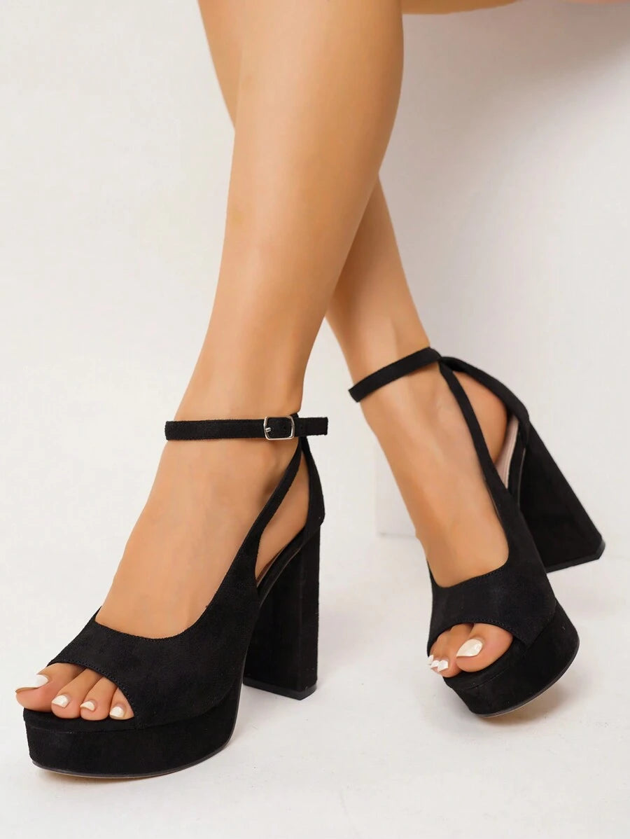 Step into the spotlight with these stunning silver platform sandals that blend glamour with modern edge. The shimmering metallic finish catches every light, while transparent straps create an illusion of floating elegance on your feet. The elevated platform adds confidence to your stride without sacrificing comfort, making these the perfect companion for nights out, celebrations, and moments when you want to feel absolutely fabulous. Whether you're dancing till dawn or making a grand entrance, these sandals