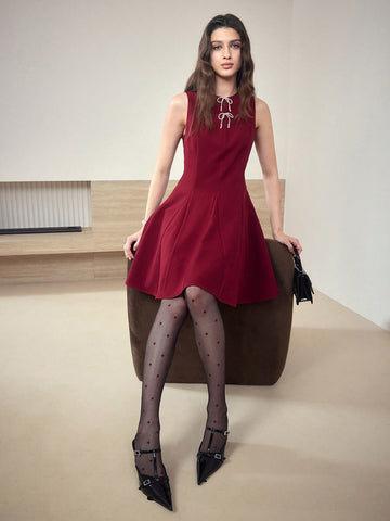 Turn heads effortlessly in this chic sleeveless dress, featuring a playful bow detail that adds a touch of whimsy to your elegant look. Perfect for any occasion where you want to feel stylish and confident, this dress combines comfort with a flirty flair. Embrace your fashion-forward side and make every moment a statement!