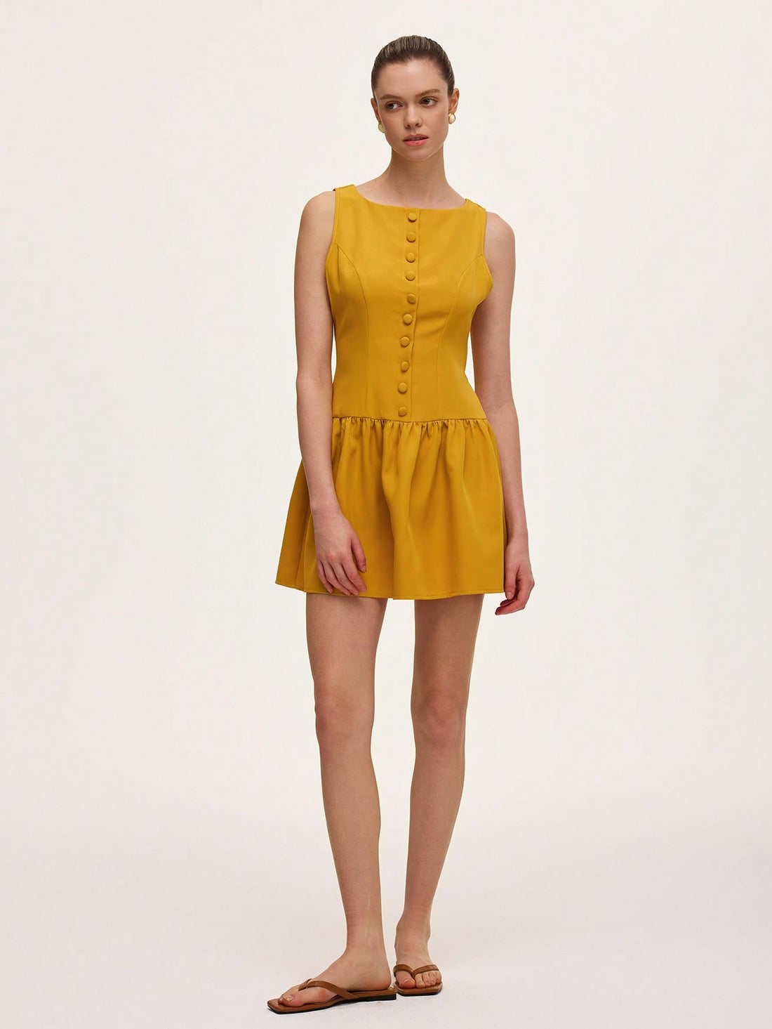 Step out in style with this chic sleeveless midi dress featuring a charming French ruffle hem. Its playful silhouette offers effortless elegance, perfect for twirling through sunny afternoons or dazzling at evening soirees. Light, breezy, and fabulously flirty—this dress is your new go-to for turning heads with ease.