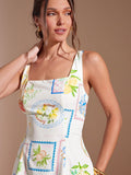 Embrace sunny days in this playful sleeveless mini sundress, adorned with a vibrant tropical fruit print. Its lightweight design keeps you cool while turning heads on every summer outing. Perfect for beach trips or casual strolls, this dress brings effortless fun and fresh style to your warm-weather wardrobe.