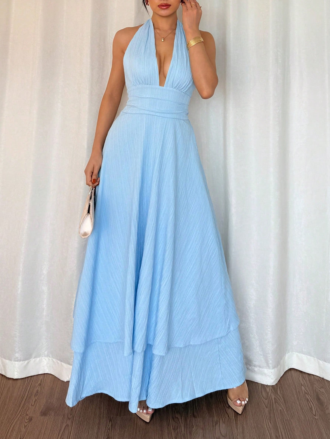 Step into sunshine and style with this chic sleeveless V-neck halter dress. Its tie-waist design flatters your figure while keeping things breezy for beach holidays and resort escapes. Whether you’re lounging by the shore or strolling sunset boardwalks, this slim-fit dress blends comfort with a playful, effortless vibe. Perfect to pack for your next getaway!