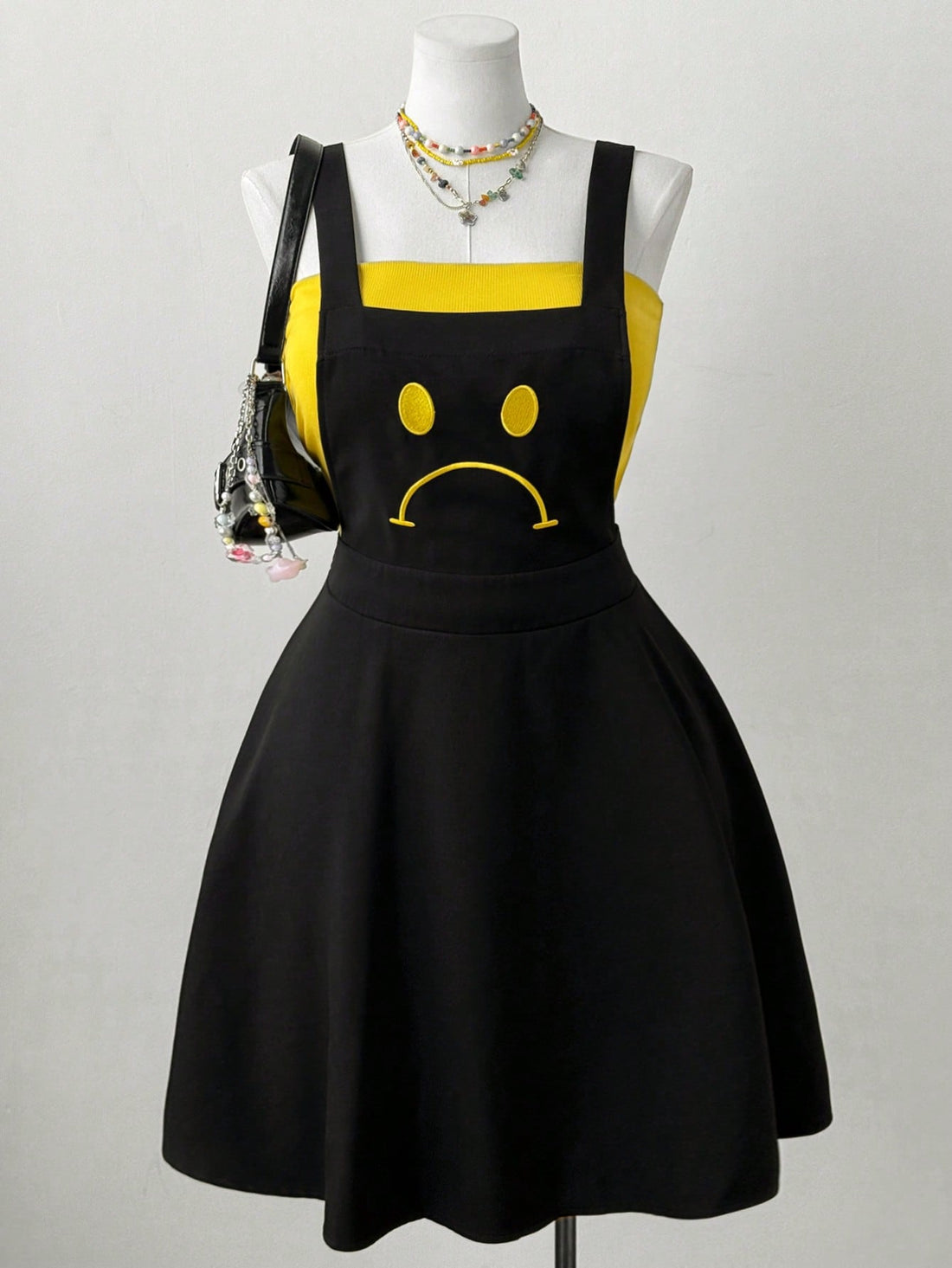 Unleash your inner fashionista with our Chic Smiling Face Strap Dress! This casual and versatile piece is the ultimate fashion statement that will have you turning heads. The unique design features a playful smiling face strap, adding a touch of whimsy to your wardrobe. Perfect for any occasion, this dress will have you looking and feeling fabulous.