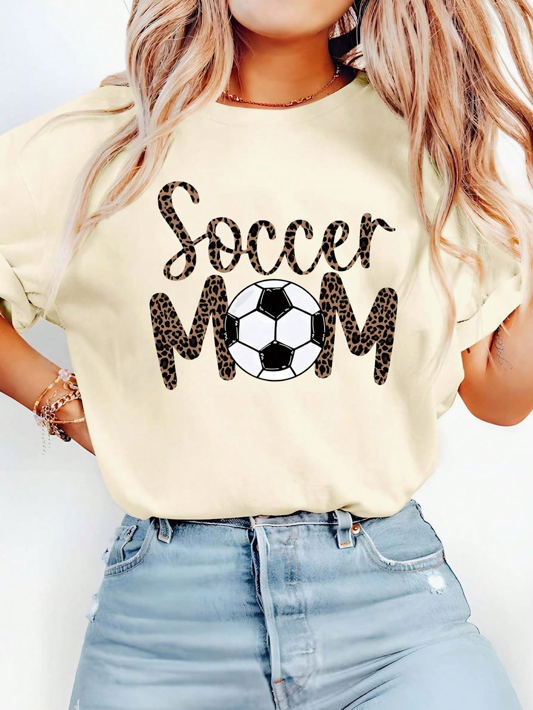 Unleash your wild side with our Chic Soccer Mom Leopard Print Graphic Tee! A fierce addition to your casual summer wardrobe, this tee features a stylish leopard print and a playful nod to motherhood. Perfect for the soccer field or a day out shopping, this tee will have you scoring style points everywhere you go!