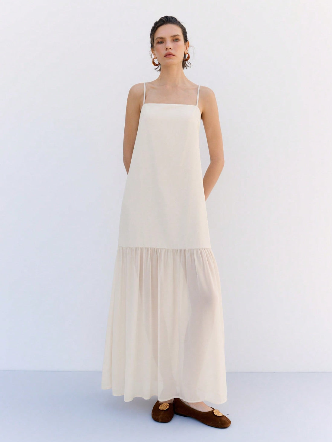 Step into sunshine with this Chic Solid Apricot Maxi Dress, featuring playful ruffle hems and delicate spaghetti straps. Perfect for spring and summer getaways, its breezy design keeps you cool while turning heads wherever you go. Embrace effortless style and vacation vibes in one flattering, flowy dress.