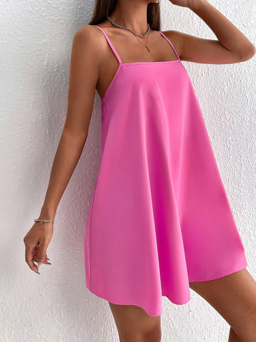 Effortlessly chic and perfect for the summer, this backless cami dress in pastel is a must-have for any fashion-forward individual. Its solid color adds a touch of sophistication, while the backless feature adds a playful and flirty element. Summer style has never been so easy!