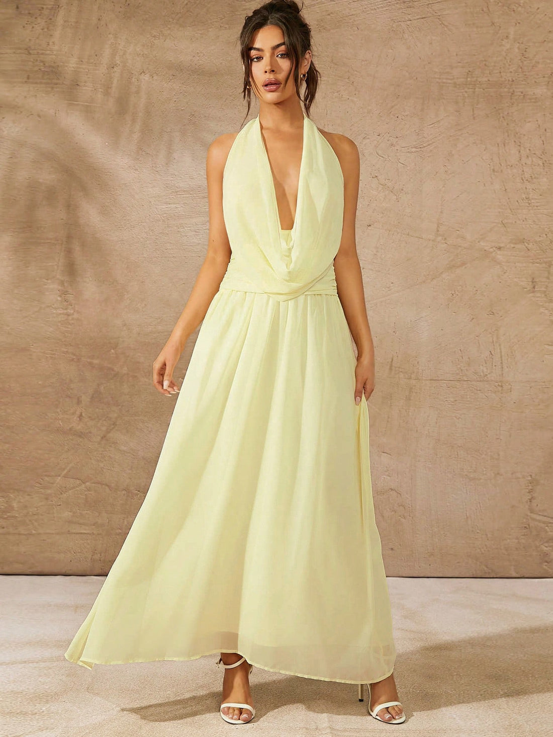 Effortlessly elevate your style with our Chic Solid Color Halter Tie Back Ruched Long Dress. This stunning piece is perfect for casual holidays, offering a flattering fit with its ruched design and tie back halter. Its solid color adds a touch of elegance, making it a versatile addition to your wardrobe.