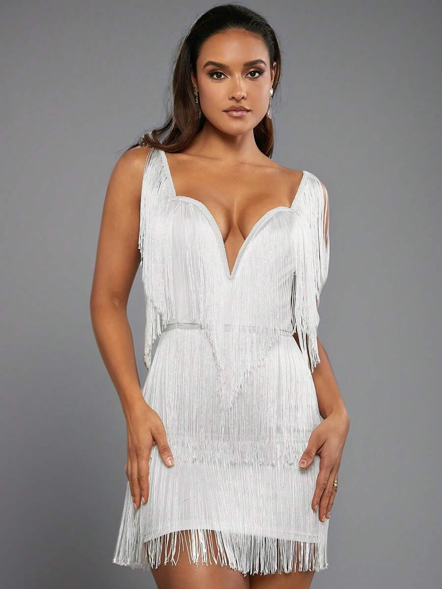 Slip into this playful dress that dances with every step! Featuring delicate spaghetti straps and multi-layered tassels, its solid color keeps things effortlessly chic while adding a flirty country vibe. Perfect for twirling through warm days or casual nights, this dress blends easy comfort with spirited style.