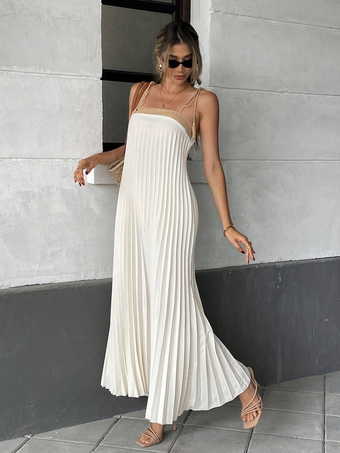 Unleash your inner fashionista with our Chic Pleated Tassel Strap Dress - the perfect addition to your vacation wardrobe! With its trendy tassel straps and flattering pleated design, this dress will have you standing out from the crowd. So why wait? Grab one now and get ready to slay!