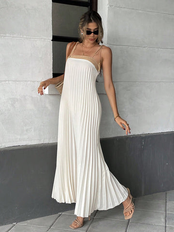 Unleash your inner fashionista with our Chic Pleated Tassel Strap Dress - the perfect addition to your vacation wardrobe! With its trendy tassel straps and flattering pleated design, this dress will have you standing out from the crowd. So why wait? Grab one now and get ready to slay!