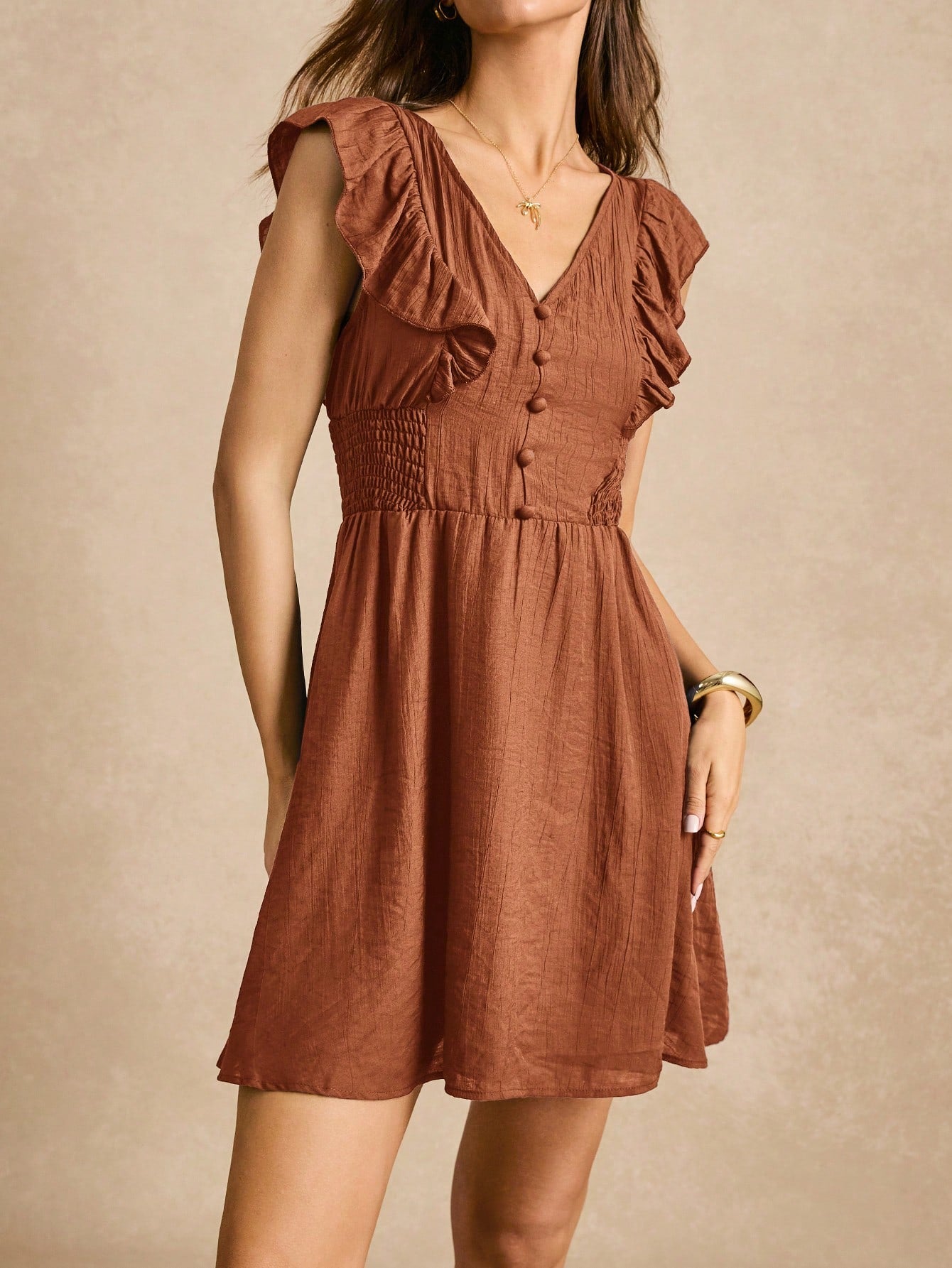 This dress is all about the details! With a chic A-line cut and ruffle trim, it's both stylish and playful. The button front adds some extra charm. Perfect for any occasion, this dress will have you feeling confident and fabulous.