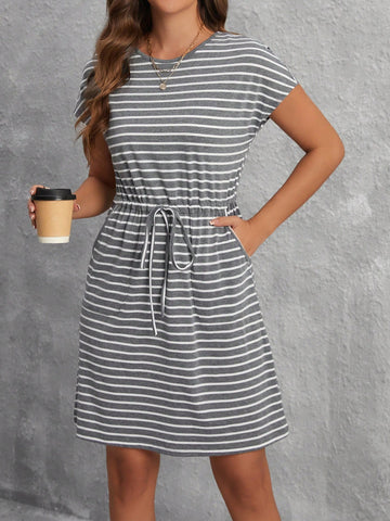 Add a touch of chic to your spring wardrobe with this cinched waist casual dress featuring playful stripes and convenient pockets. Flatter your figure and stay stylishly comfortable all day. Perfect for any occasion. Who says you can't have it all?
