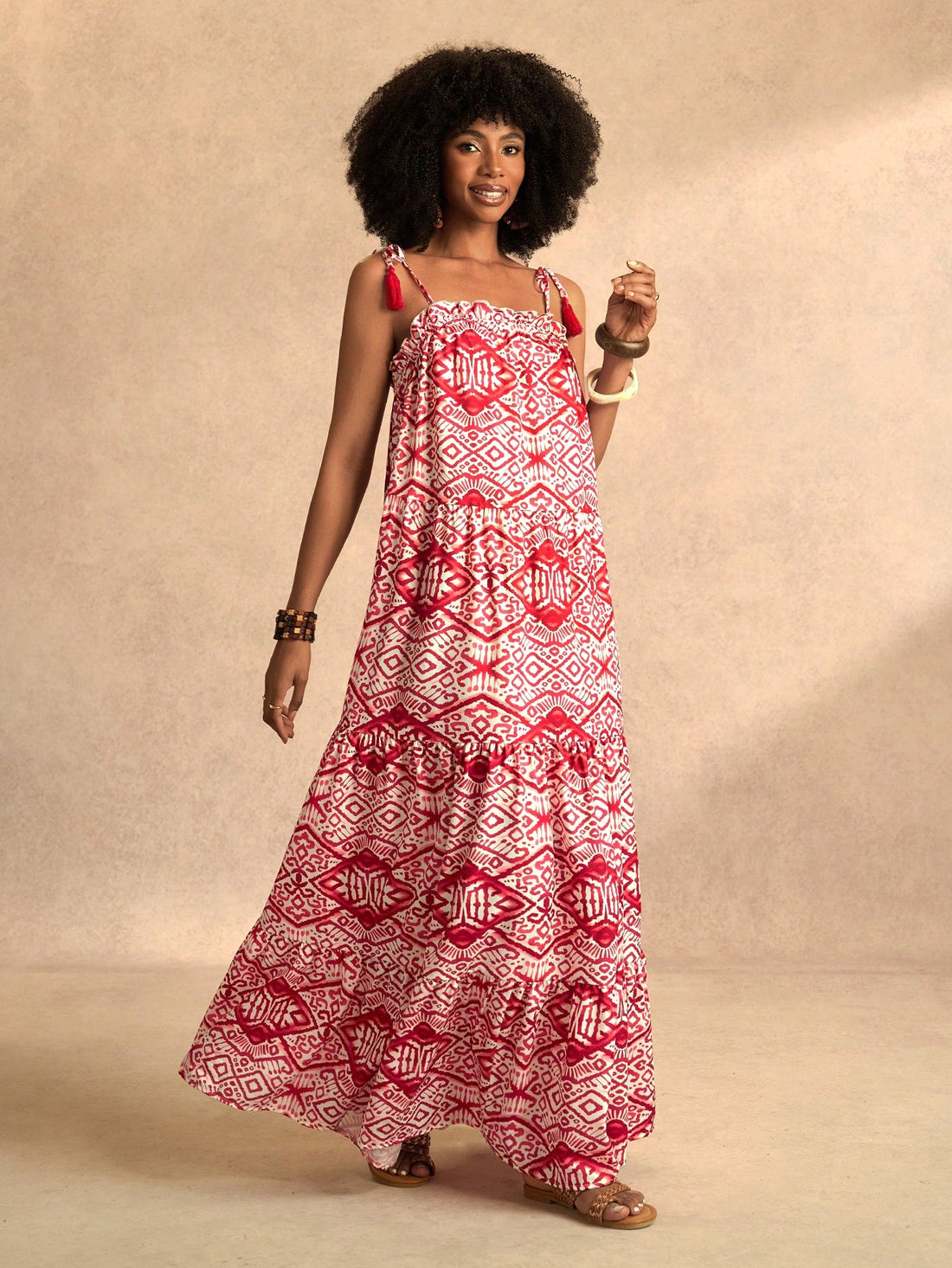 Embrace effortless beach style with our Chic Spring & Summer Maxi Dress. This stunning dress features tassel details and a vibrant floral print, perfect for the season. Enjoy a playful and carefree look while being on-trend. Who says you can't look effortlessly chic at the beach? (Hint: It's definitely not us!)