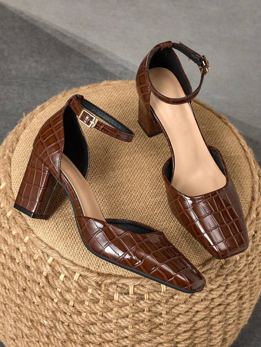 Step into sophistication with these stunning square-toe pumps that effortlessly transition from boardroom to evening out. The sleek buckle closure adds a touch of polish while the 7cm chunky heel provides all-day comfort without sacrificing style. Perfect for anyone who refuses to choose between looking fabulous and feeling great, these versatile heels are your go-to for making a memorable impression at work or special events.