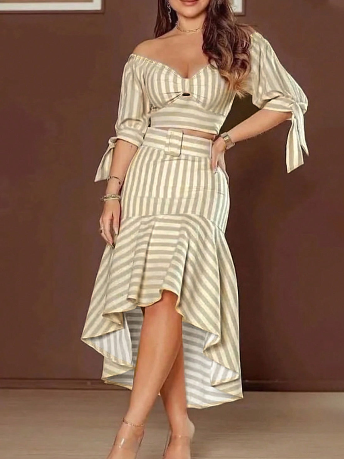 Stripes never go out of style—and this charming two-piece set proves it! Featuring a relaxed shoulder top paired with a flowing skirt, you've got an instant outfit that works from brunch to casual evenings. The playful stripe pattern adds visual interest without demanding much effort, while the comfortable silhouette keeps you feeling confident and breezy. Mix it, match it, or wear it as the perfect set—either way, you're serving effortless elegance with a fun twist.