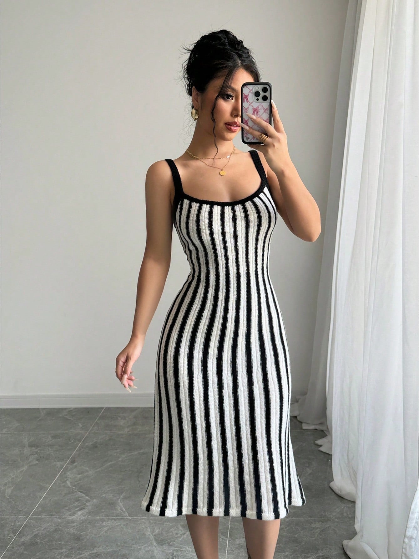 Elevate your style with our Chic Striped Knit Camisole Dress, a French fashion essential. Made with a flattering silhouette and breathable knit fabric, this dress is perfect for any occasion. Stand out from the crowd with its chic stripes and enjoy the comfort and sophistication of French fashion.