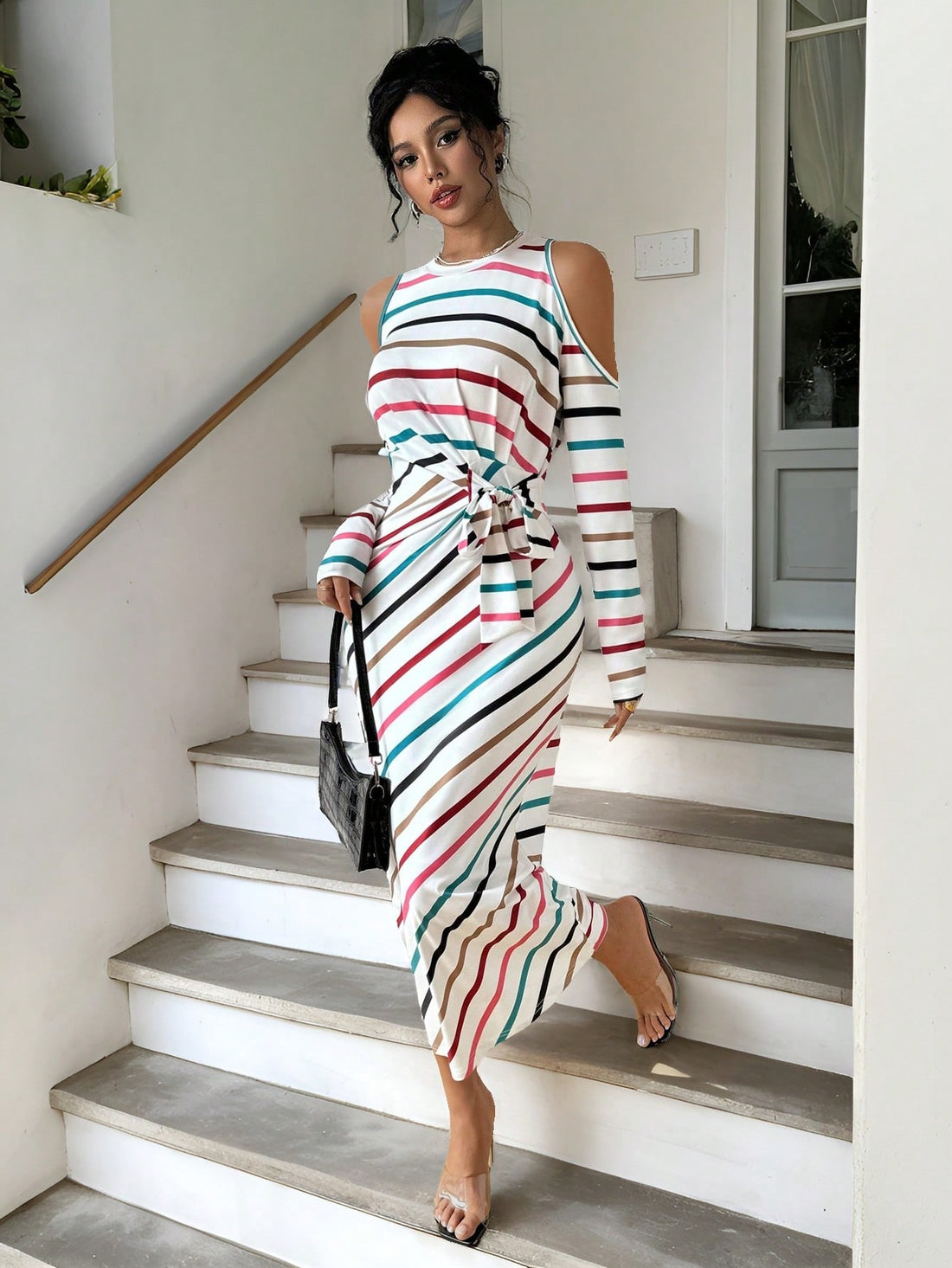 This stylish midi dress features chic stripes, open shoulders, and a tie waist, making it the perfect choice for any spring or autumn occasion. With its on-trend design and comfortable fit, this dress is sure to elevate your style and keep you looking and feeling confident.