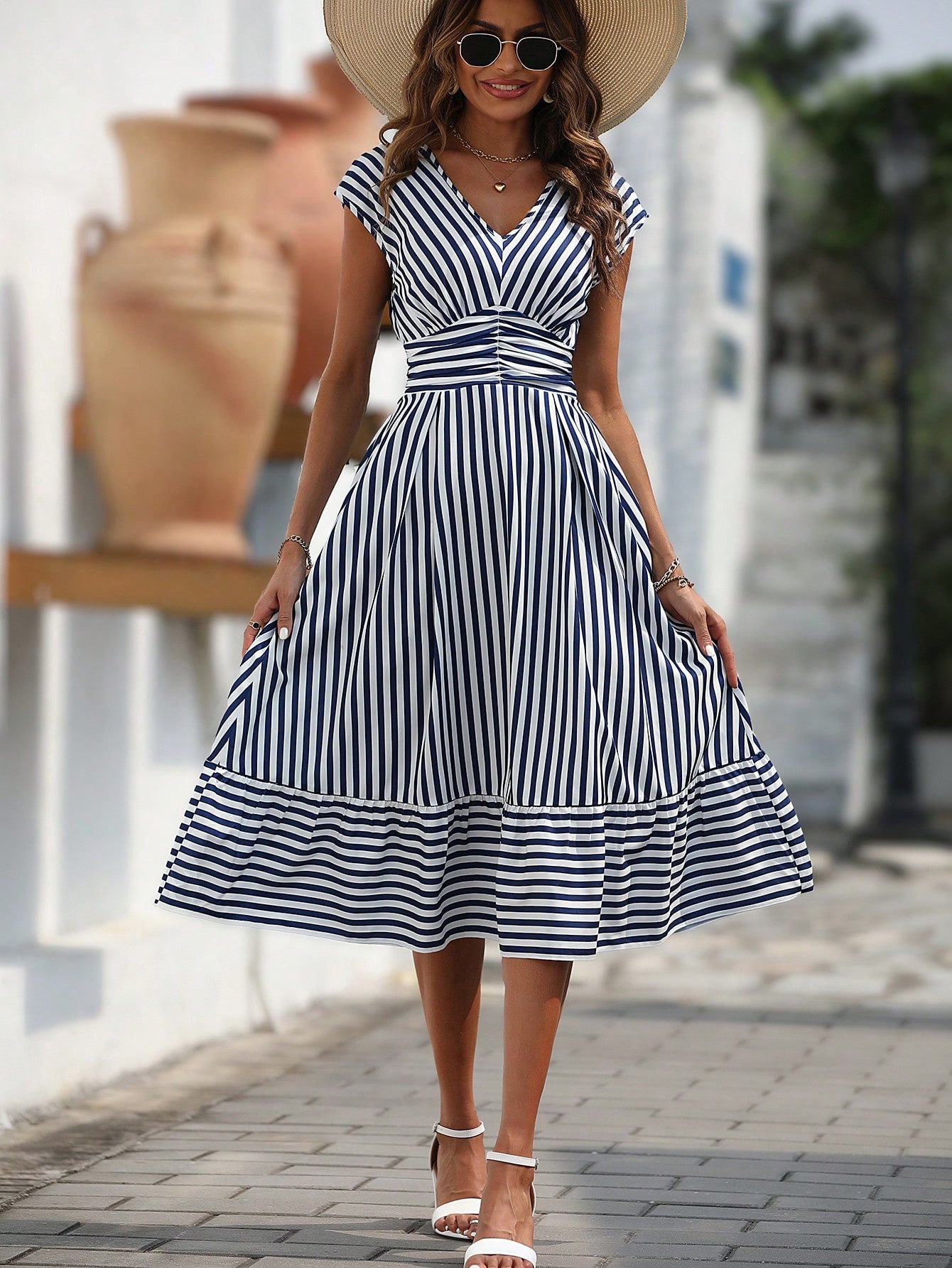 Step out in style with our Chic Striped Ruffle Hem Dress, perfect for any occasion. This dress features a flattering ruffle hem and a timeless striped print, making it a versatile addition to your wardrobe. Stay on trend and make a statement with this must-have dress.