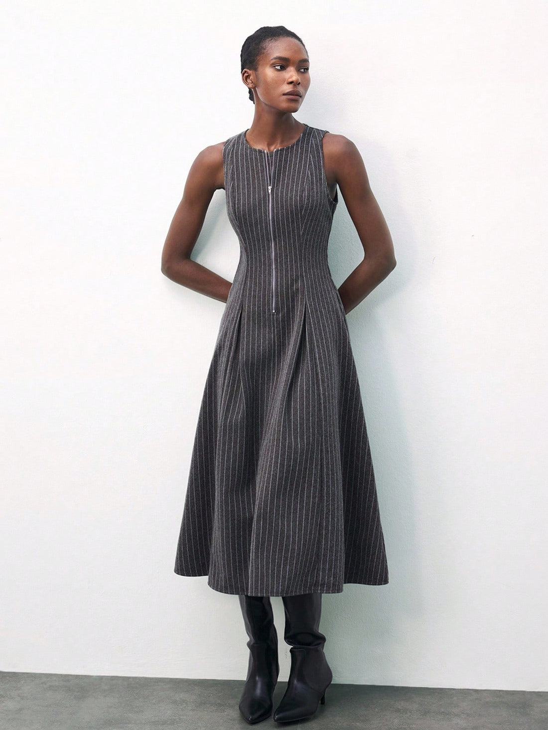 Slip into autumn charm with this Chic Striped Sleeveless Dress designed for playful elegance. Featuring a zipper half placket for easy style and pleated details that dance with every move, it’s perfect for layering or wearing solo. Embrace crisp days in a dress that’s as lively and vibrant as the season itself!