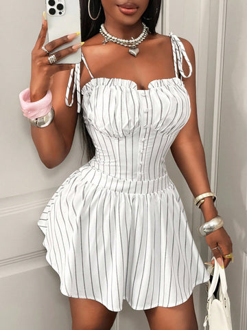 This playful mini dress features chic stripes and delicate spaghetti straps, making it your go-to for breezy summer days. Its flattering fit and lightweight fabric keep you cool and stylish, whether you're headed to a picnic or a sunset stroll. Effortless charm has never looked so fun!