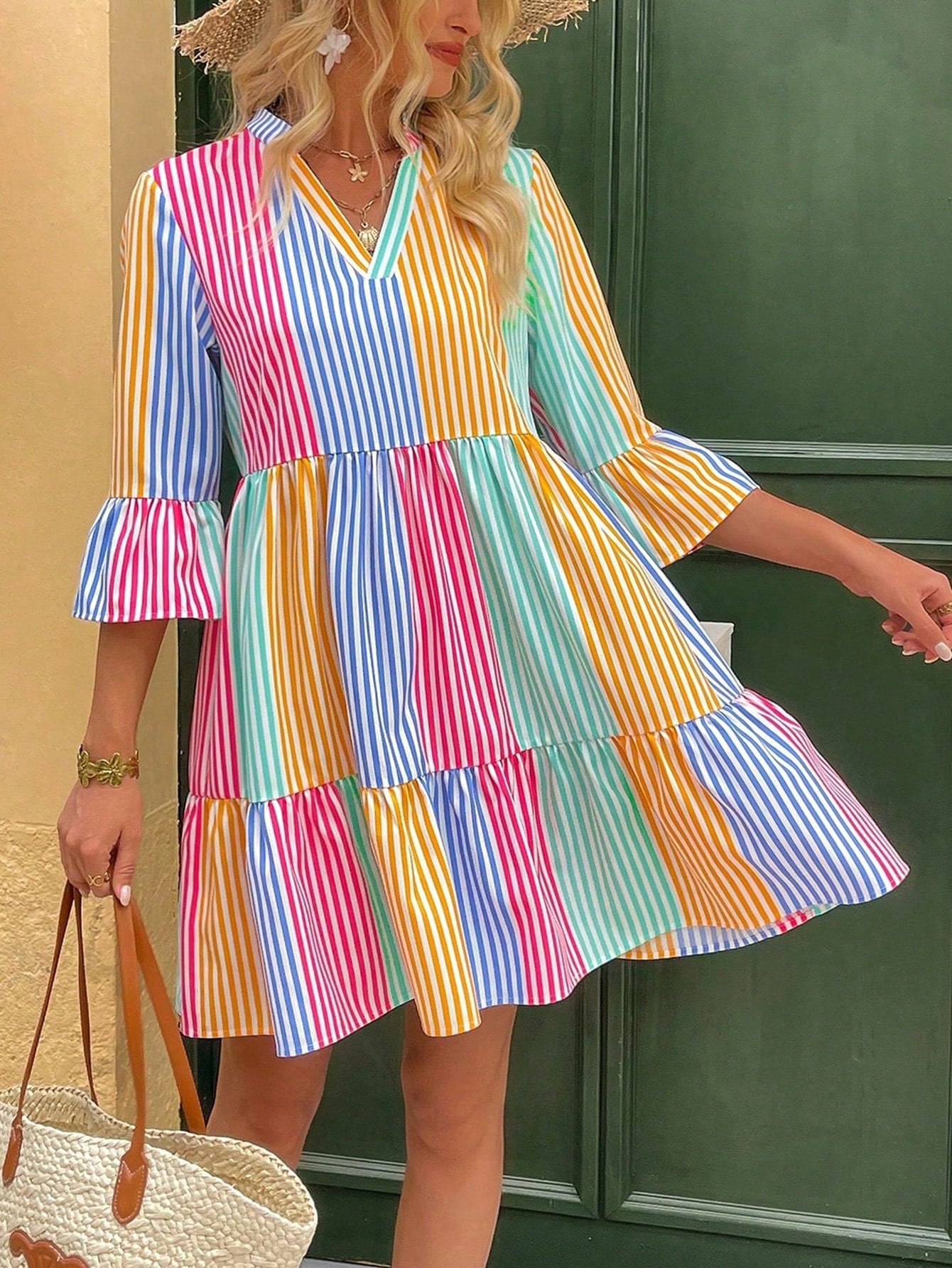 Get ready to turn heads this holiday season with our Chic Striped V-Neck Flare Sleeve Dress! Designed for effortless style, this dress features a flattering V-neck and flared sleeves. With its eye-catching striped pattern, you'll be the center of attention at any holiday gathering.