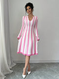 Take on the changing seasons with this effortlessly stylish Chic Striped V-Neck Long Sleeve Sweater Dress. The classic v-neck and long sleeves keep you cozy, while the bold stripes add a touch of playfulness. Perfect for a fun and fashionable spring or autumn look.