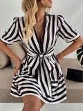 Upgrade your wardrobe with this Chic Striped V-Neck Puff Sleeve Dress. The unique bow tie waist adds a touch of playfulness while the puff sleeves add a touch of elegance. Perfect for any occasion, this dress will surely turn heads and make a statement.