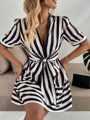 Upgrade your wardrobe with this Chic Striped V-Neck Puff Sleeve Dress. The unique bow tie waist adds a touch of playfulness while the puff sleeves add a touch of elegance. Perfect for any occasion, this dress will surely turn heads and make a statement.