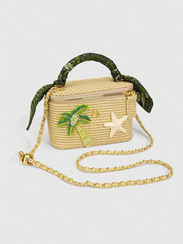 Natural straw tropical box crossbody bag with green wrapped handle and gold chain strap