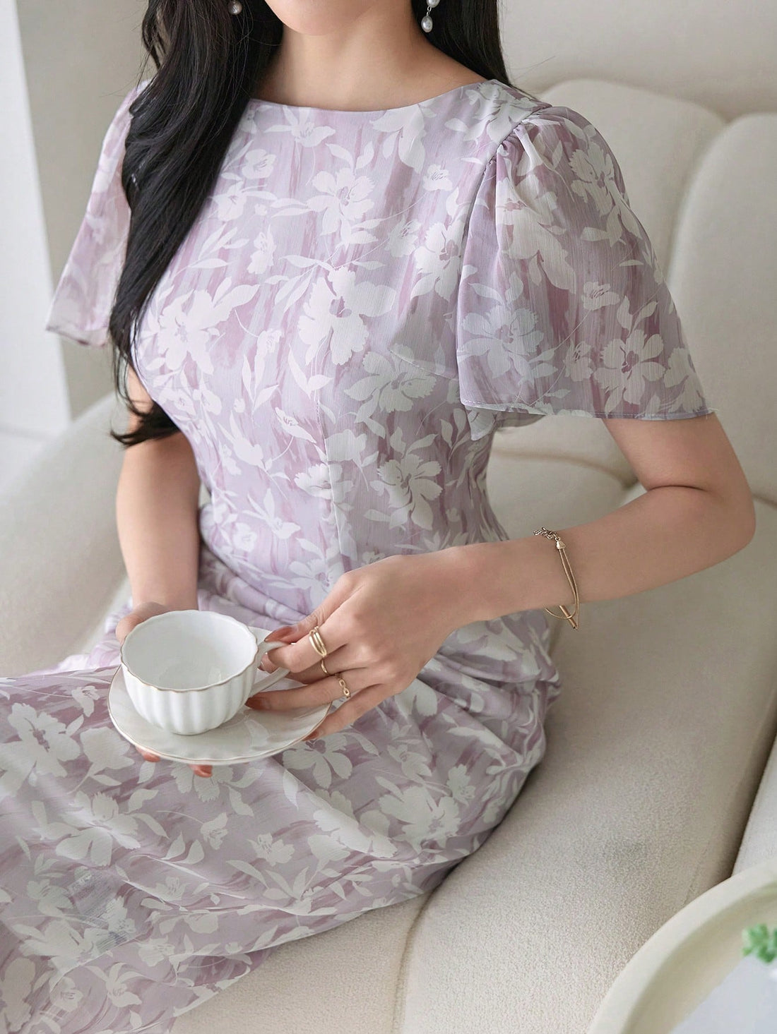 Twirl into summer with our Ditsy Floral Midi Dress! Those adorable ruffle sleeves add just the right amount of flirty fun, while the midi length keeps things classy. Perfect for garden parties, brunch dates, or whenever you want to feel like the sunshine goddess you are! The delicate floral pattern practically dances with every step.