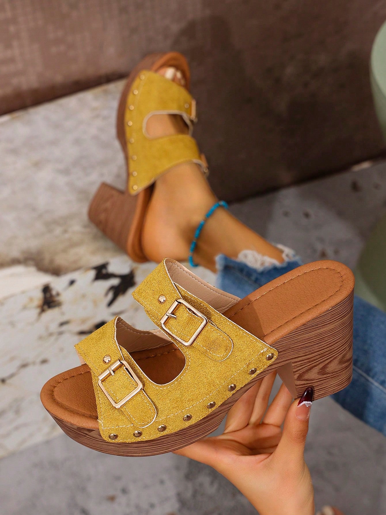 Score a chic summer look with our Double Breasted Chunky Heel Slide Sandals. Featuring a unique double-breasted design and edgy rivet details, these slides are perfect for adding a touch of fun to any outfit. Step out in style and comfort with our chunky heel and slide-on design.