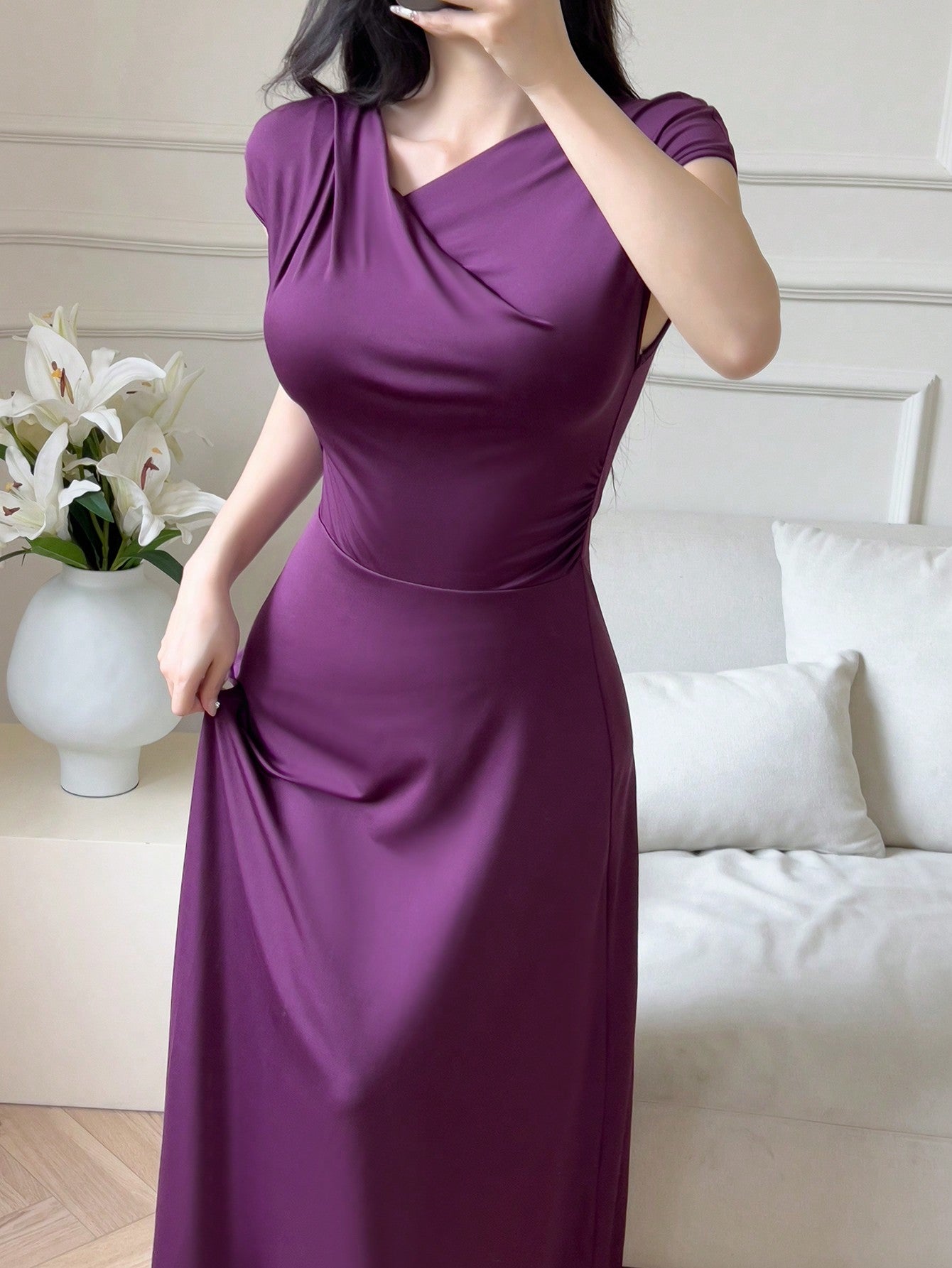 Embrace the chic summer elegance with this asymmetrical neckline solid color dress. The unique neckline adds a touch of style, while the solid color allows for versatile dressing options. Perfect for any summer occasion, this dress is your new go-to for effortless style.