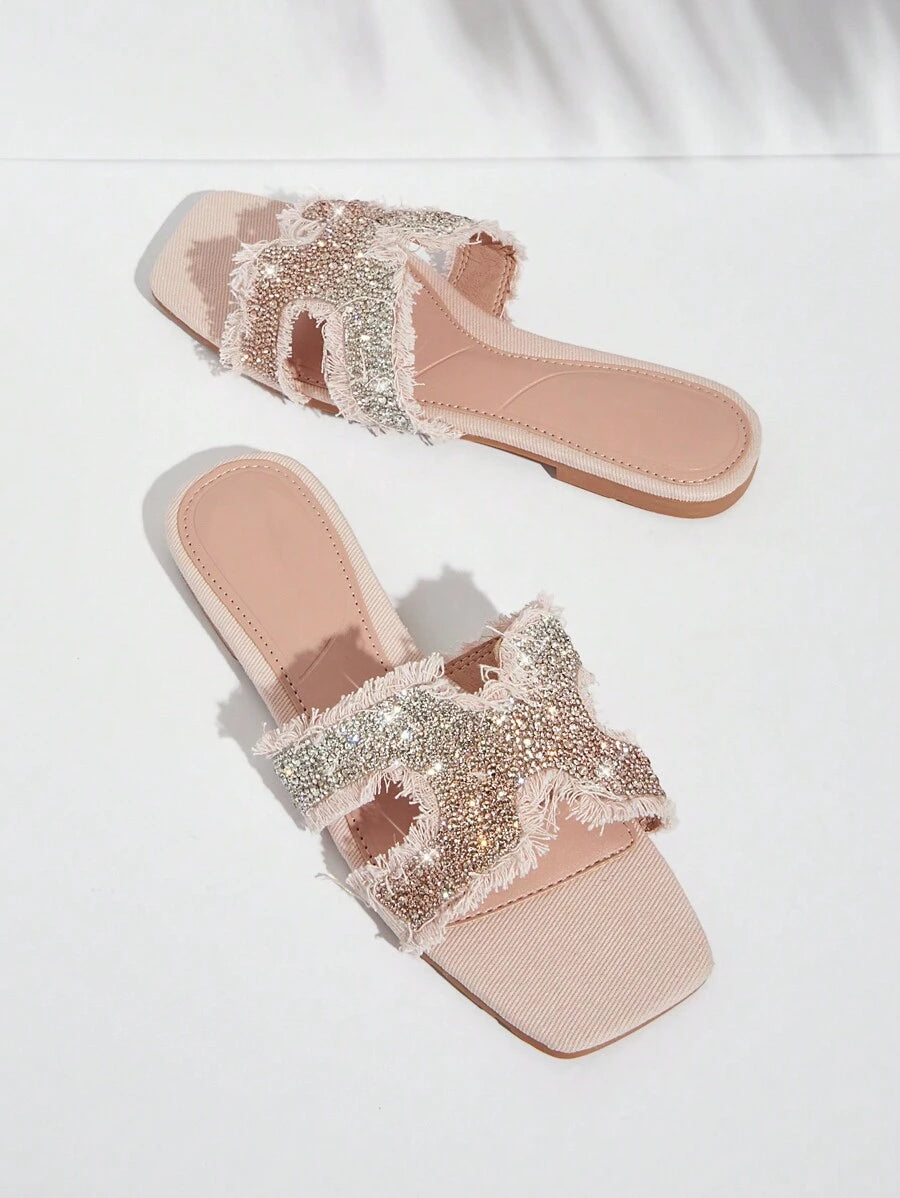 Step into summer with these chic flat sandals for women! The fringe and sparkling glitter details add a playful touch to any outfit. You'll be sure to turn heads and stay comfortable all day. (No more boring sandals, am I right?!)