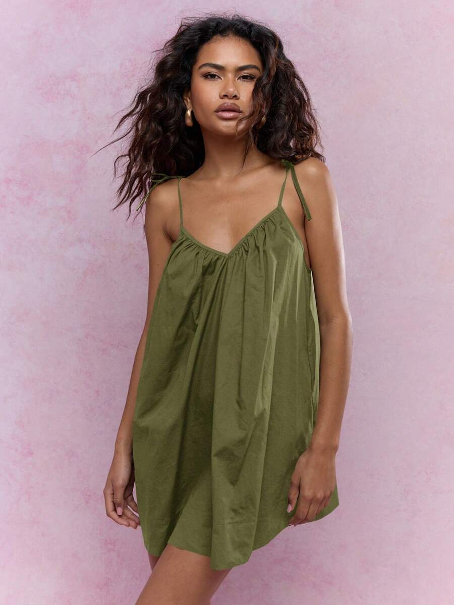 Enjoy sunny days in style with this Chic Summer Mini Smock Dress. Lightweight and breezy, its playful tie-shoulder design makes it an effortless beach cover-up or vacation staple. The smock silhouette offers comfort and a flattering fit, perfect for carefree moments by the sea or casual strolls. Embrace the warm weather with a fun, flirty dress that keeps you cool and confident wherever your travels take you.