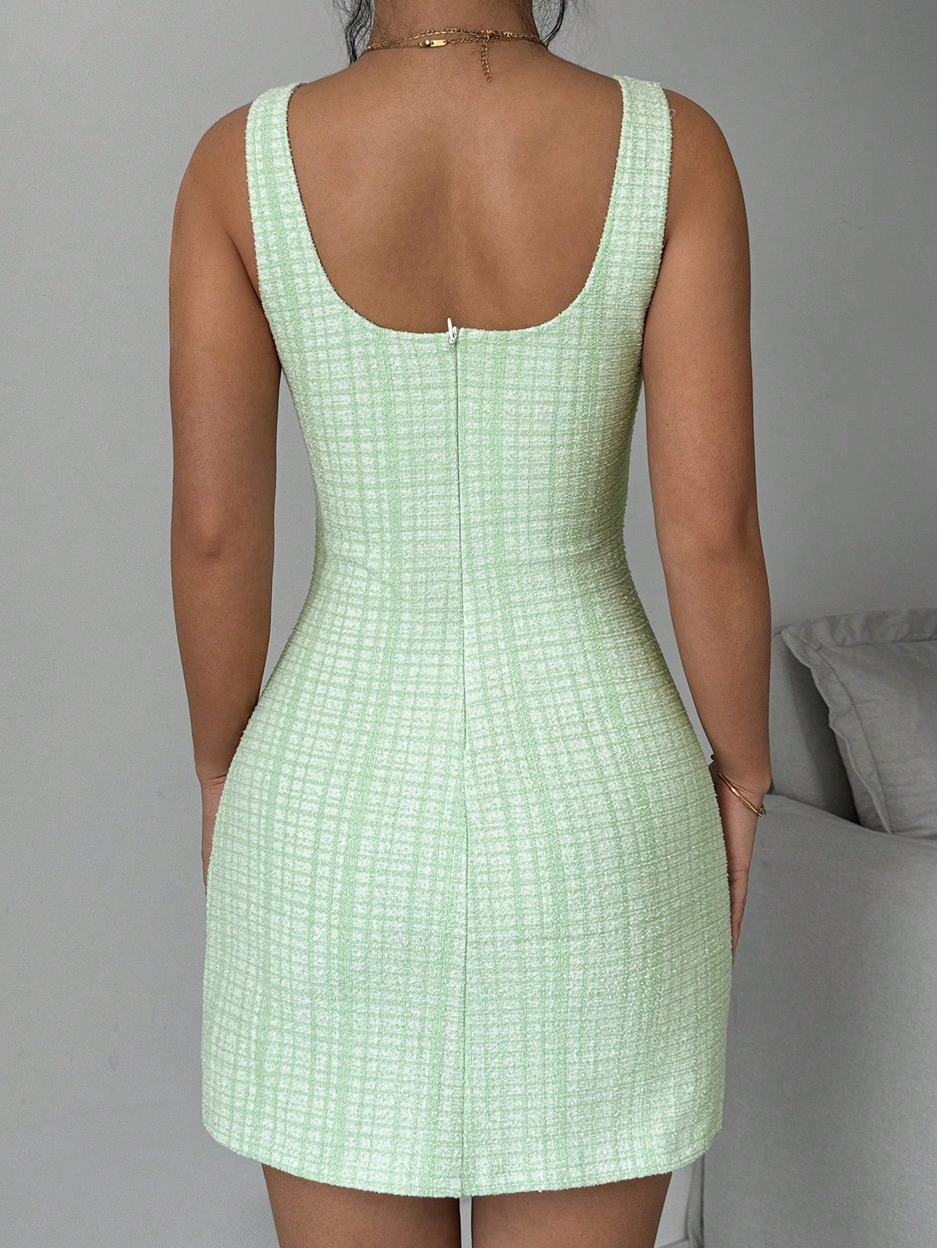 Introducing the must-have Chic Summer Plaid Dress! With a sleeveless design and elegant round neck, this dress is perfect for any summer occasion. Stand out in style and let your playful side shine with this quirky and chic piece. (Only 46 words. No buzzwords. No quotes.)