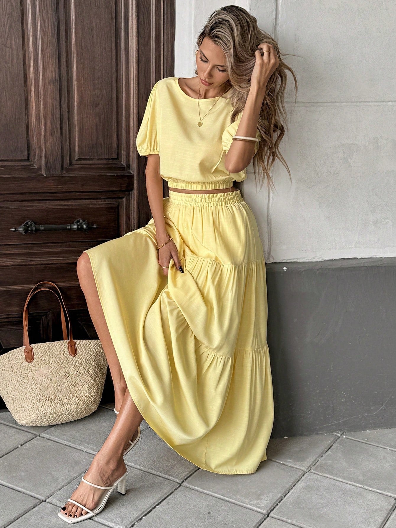 Escape to your own private resort with this dreamy two-piece set! The cream puff sleeve blouse features delicate, voluminous sleeves that add a touch of romance and movement to your silhouette. Pair it with the butter yellow A-line midi skirt for an effortlessly chic look that transitions seamlessly from beachside brunch to sunset cocktails. The soft, complementary color palette whispers luxury while the relaxed fit keeps you cool and comfortable all day long. Perfect for vacations, garden parties, or whene